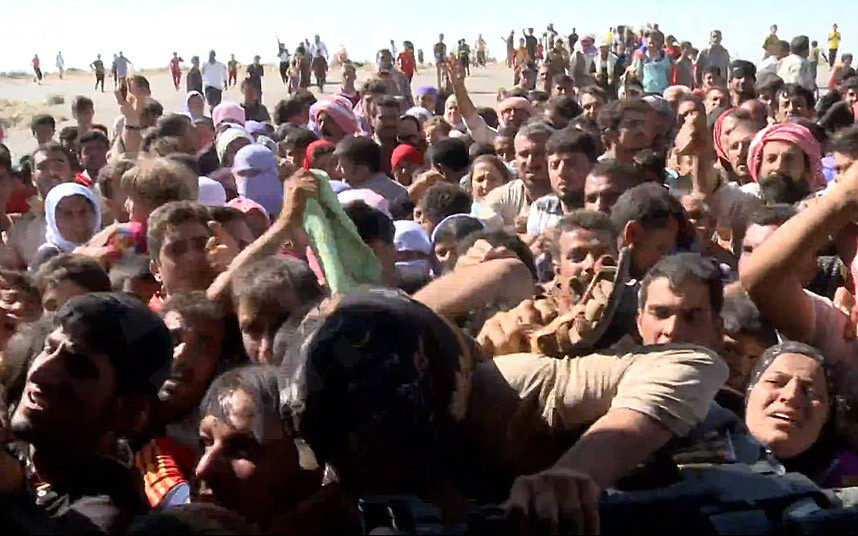 yazidis-in-northern-iraq-storm-an-helicopter-