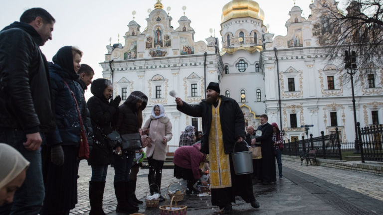 Orthodox Christians Observe Easter with Candles, Prayers, and Political Messages