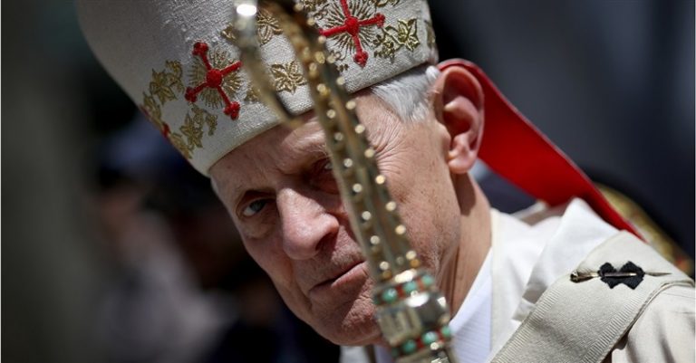 Protester Shouts ‘Shame on You’ at Archbishop Wuerl during Mass