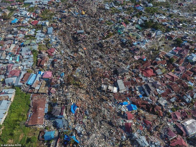 Astonishing Moment a Building ‘Floats’ Past After Tremors Liquefy the Ground, Swallowing 1,700 Homes in Indonesia as Mass Grave Is Dug for More Than a Thousand Victims